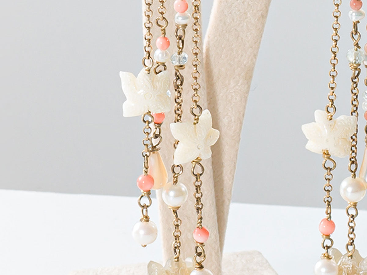 Orecchini corallo rosa elementi marini conchiglie e stelle